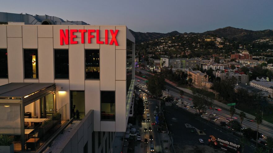 The Netflix logo is seen on top of their office building in Hollywood, Calif. The streaming service has laid off some employees of its companion website called Tudum.