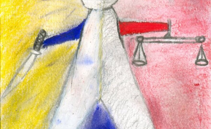 Ta Kwe Say, 23, says this drawing in the book 'Forced to Flee' depicts how Burmese army recruits are programmed to choose violence over justice.