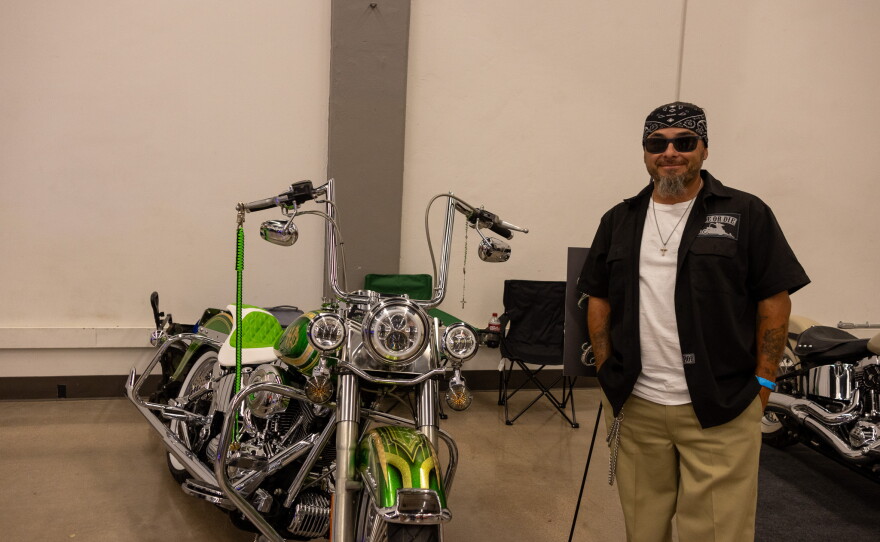 Ronnie Sanders standing with his 2007 Harley Davidson Softail, photo by Alexander Brown.