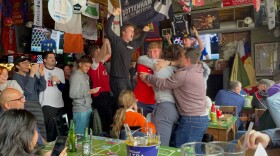 Fans celebrate after England's national team scores a goal in its World Cup match against France on Saturday, Dec. 10, 2022 at Empire Bar in Tulsa.