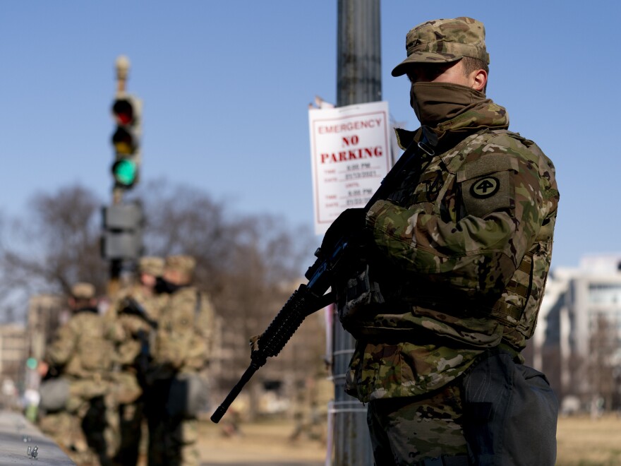 Armed members of the National Guard deployed outside the U.S. Capitol on Thursday.