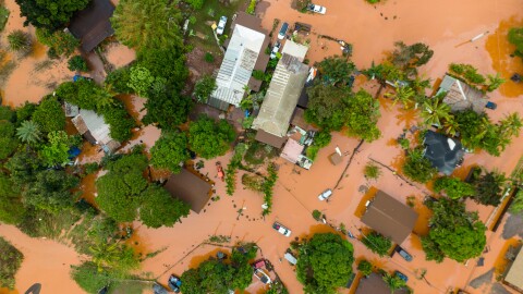 An aerial view of homes surrounded by floodwaters in Waialua, Hawaiʻi, Friday, March 20, 2026.