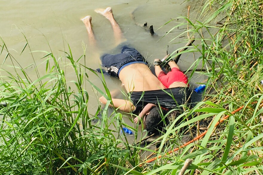The bodies of Óscar Alberto Martínez Ramírez and his nearly 2-year-old daughter, Valeria, lie on the bank of the Rio Grande in Matamoros, Mexico, where they were found Monday morning. They drowned while trying to cross the river to Brownsville, Texas. This photograph was first published in the Mexican newspaper <em>La Jornada</em>.