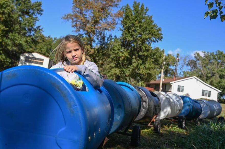 Maggie Decker, 8, rides the barrel train last weekend at Boots Farms in Moberly.