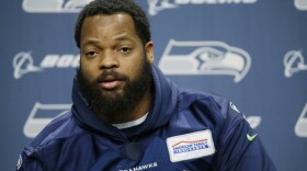 Seattle Seahawks defensive end Michael Bennett talks to reporters, Tuesday, Jan. 10, 2017, in Renton, Wash. The Seahawks will play the Atlanta Falcons in an NFL football NFC playoff game, Saturday, Jan. 14, 2017 in Atlanta (AP Photo/Ted S. Warren)