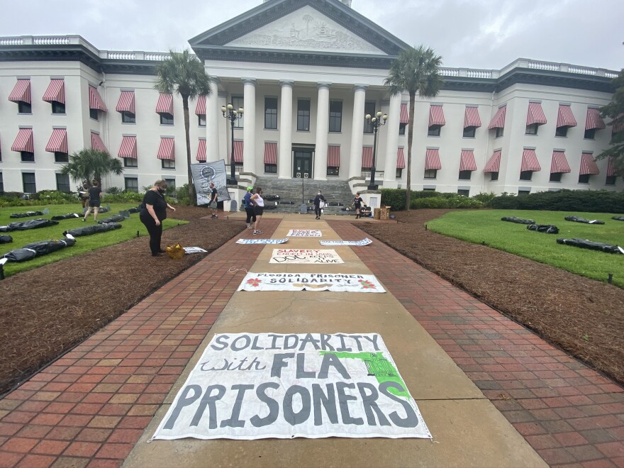 A mock-graveyard on the Historic Capitol grounds created by the Florida Prisoner Solidarity.
