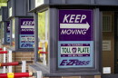 Signs on the electronic toll booths indicate to motorists entering the Pennsylvania Turnpike in Gibsonia, Pa. on Monday, Aug. 30, 2021, to keep moving and the methods being used to collect tolls. More than $104 million in Pennsylvania Turnpike tolls went uncollected last year as the agency fully converted to all-electronic tolling. Turnpike records show the millions of motorists who don’t use E-ZPass have a nearly 1 in 2 chance of riding without paying under the “toll-by-plate” license plate reader system.