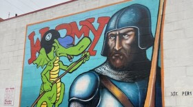 The Carbondale Chamber of Commerce celebrates the unveiling of a mural dedicated to David Trampier artist for Dungeons and Dragons.