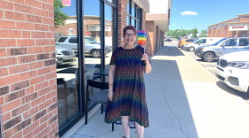 Annette Siegel Gross waves her flag with pride on the Northside of Indianapolis