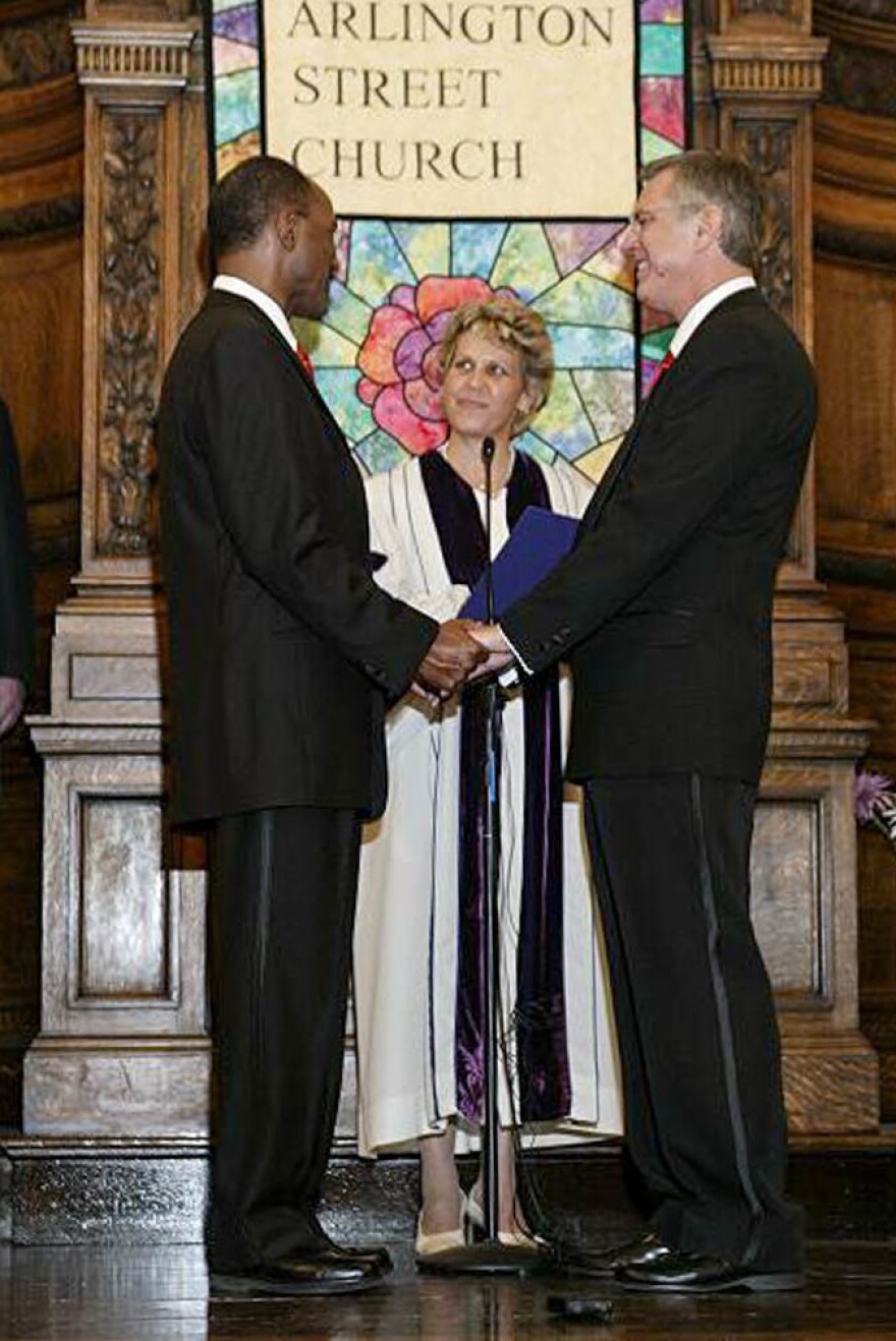 David Wilson (left) and Robert Compton with officiant Rev. Kim K. Crawford Harvie on the couple's wedding day, May 17, 2004, in Boston, Mass.