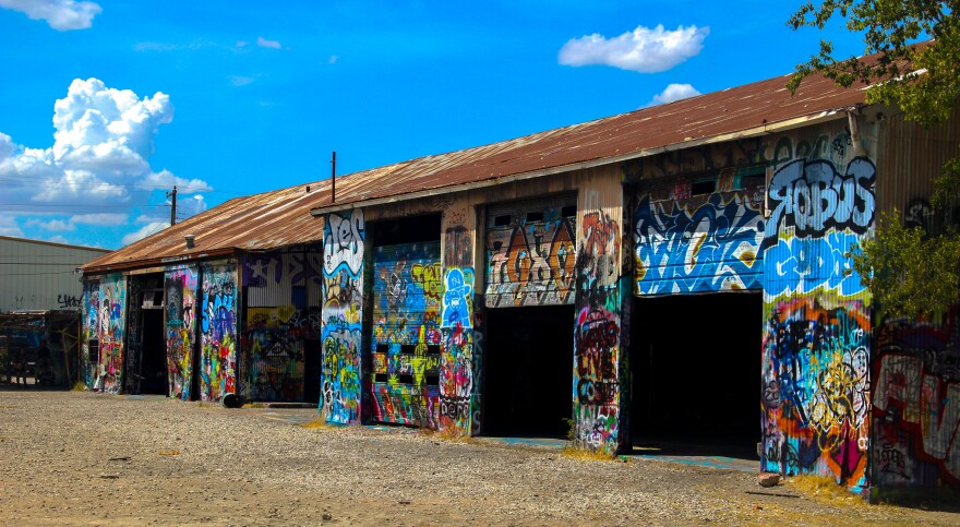 At the heart of the fabrication yard where buildings are covered in paint inside and out.