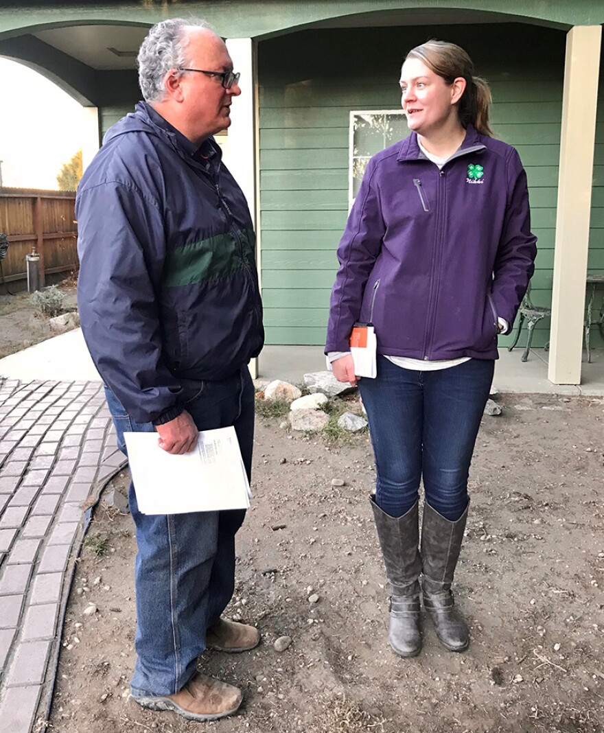 MSU Extension Agent Nikki Bailey speaks to Roberts homeowner Steve Fugere
