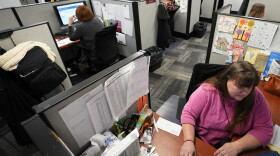 Workers field calls at an intake call screening center for the Allegheny County Children and Youth Services office in Penn Hills, Pa. on Thursday, Feb. 17, 2022.