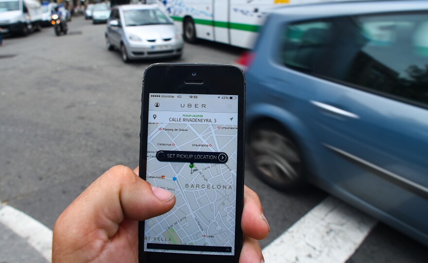 In Spain, taxi licenses can cost upward of $150,000. Drivers pay it off like a mortgage, over their career. Many worry that their investment will be worthless if private citizens can pick up fares with the Uber smartphone app.