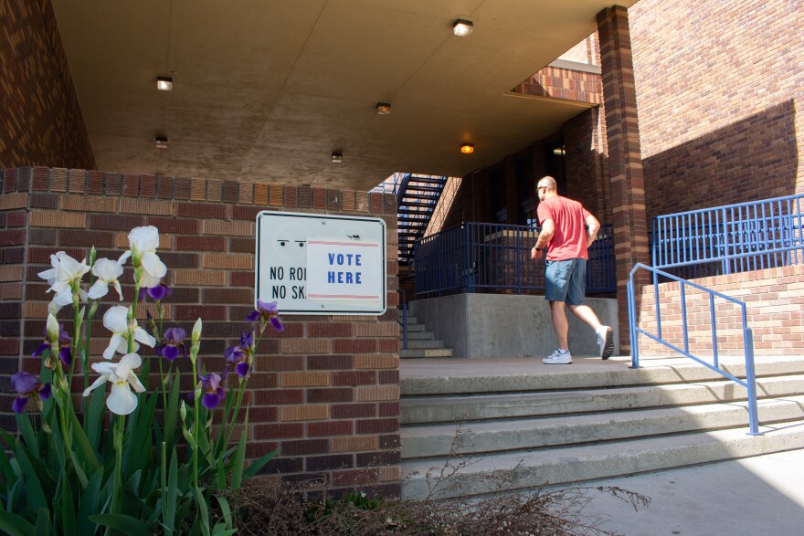 A voter walks into North Junior High School in Boise during the 2022 primary election.