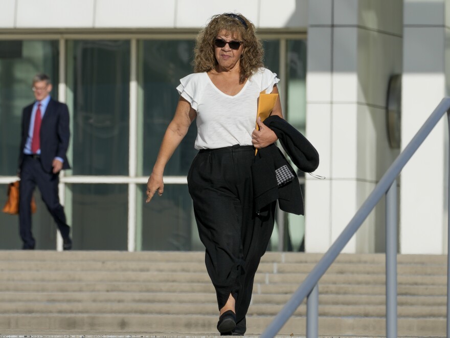 Nancy Marks leaves federal court, Thursday, Oct. 5, 2023, in Central Islip, N.Y. Marks, the ex-campaign treasurer for U.S. Rep. George Santos pleaded guilty Thursday to conspiring to defraud the U.S. government and implicated the indicted New York Republican in court with submitting bogus campaign finance reports. (AP Photo/Mary Altaffer)