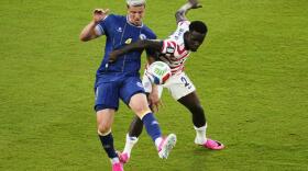 United States' Folarin Balogun (20) fouls Bosnia's Tarik Muharemovic (4), resulting in a red card go Balogun, during the World Cup round of 32 soccer match between the United States and Bosnia in Santa Clara, Calif., near San Francisco, Wednesday, July 1, 2026. (Jeff Chiu/AP)