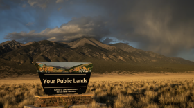 Blanca Peak in the Sangre de Cristo Mountains on the east side of San Luis Valley of Colorado, Sept. 30, 2025 provides a backdrop for a Bureau of Land Management, or BLM, sign promoting public lands.