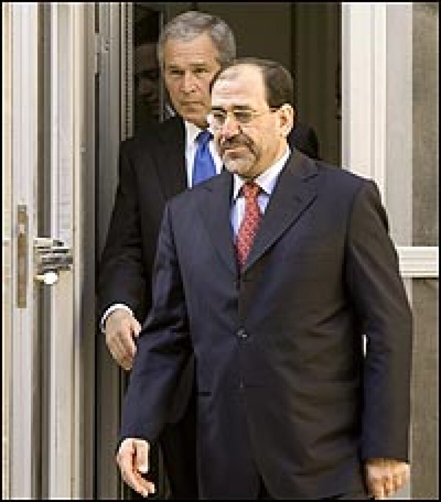 Iraqi Prime Minister Nouri al-Maliki and President Bush meet at the U.S. Embassy in Baghdad.