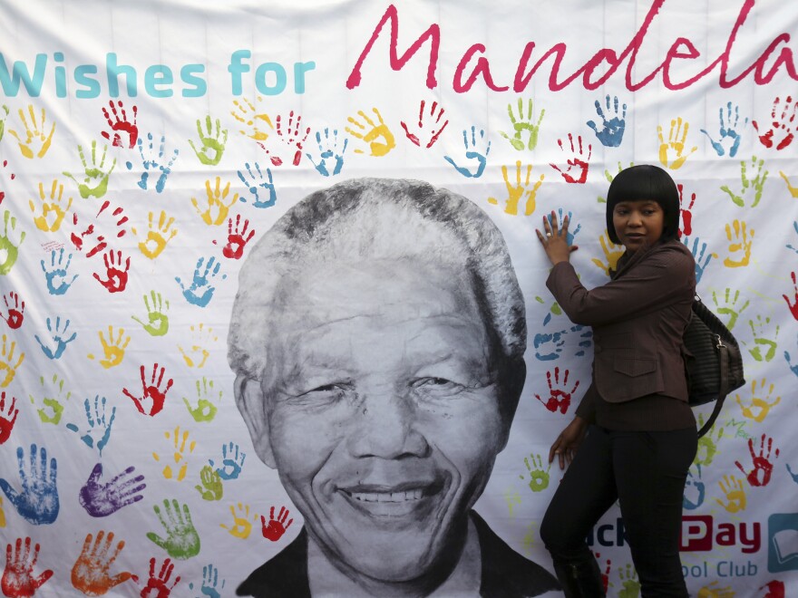 Former South African President Nelson Mandela has been in a Pretoria hospital since June 8. He's being treated for a life-threatening respiratory infection. Last week he turned 95 and a banner near the hospital drew admirers such as this woman.