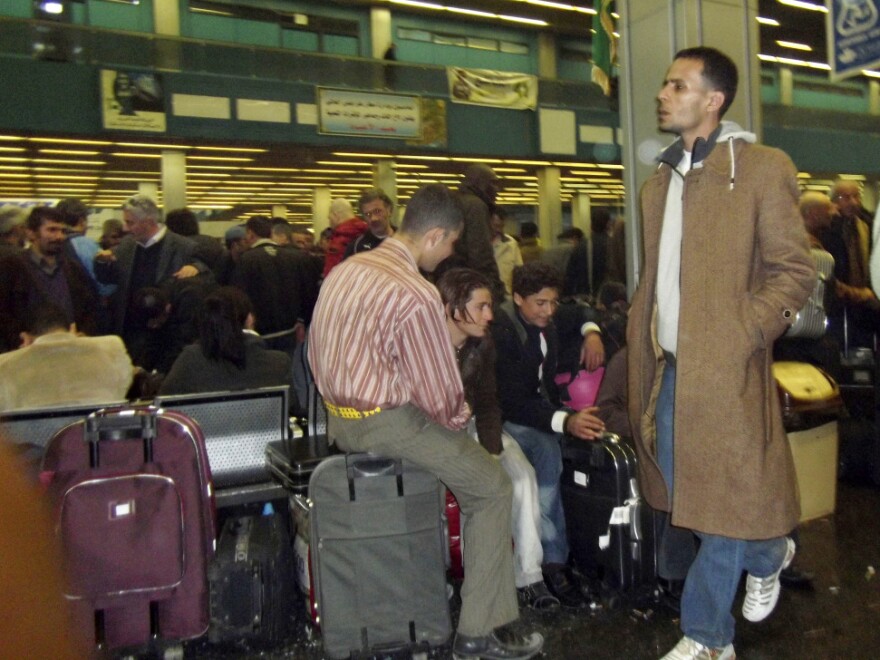 Passengers pack Tripoli's airport Tuesday, desperate to catch a flight and leave Libya. Several countries are sending planes and ferries to Libya to evacuate their citizens.