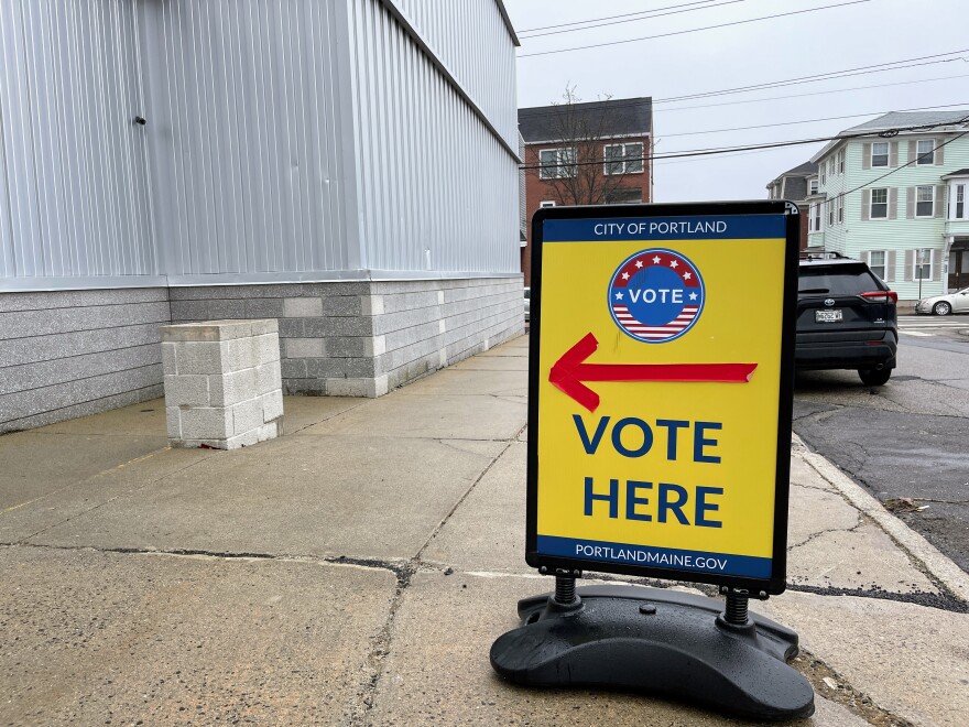 A sign directing voters stands outside a polling station at Merrill Auditorium located next to Portland City Hall on Super Tuesday