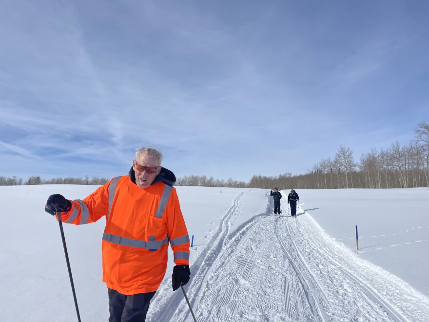 Tod Tibbetts skis along a trail on a sunny Friday morning at the West Elk Trails system near New Castle on January 13, 2023. Tibbetts manages the snowshoe and cross-country network near New Castle with help from his canine greeter, Odin. 