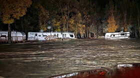 Floodwaters surround trailers at the Fun Valley Family Resort campground and RV part in South Fork, Colo., early Friday, Oct. 23, 2026. (South Fork Fire Rescue via AP)