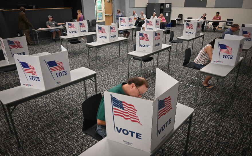  Voters at Midwest Genealogy Center in Independence cast their ballot early Tuesday morning.