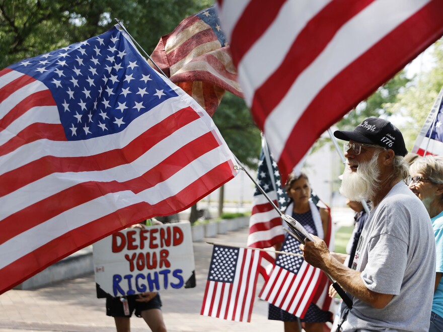 Supporters of former White House senior advisor Stephen Bannon rally outside the United States District Court House during  jury selection in his trial on July 18, 2022 in Washington, DC.