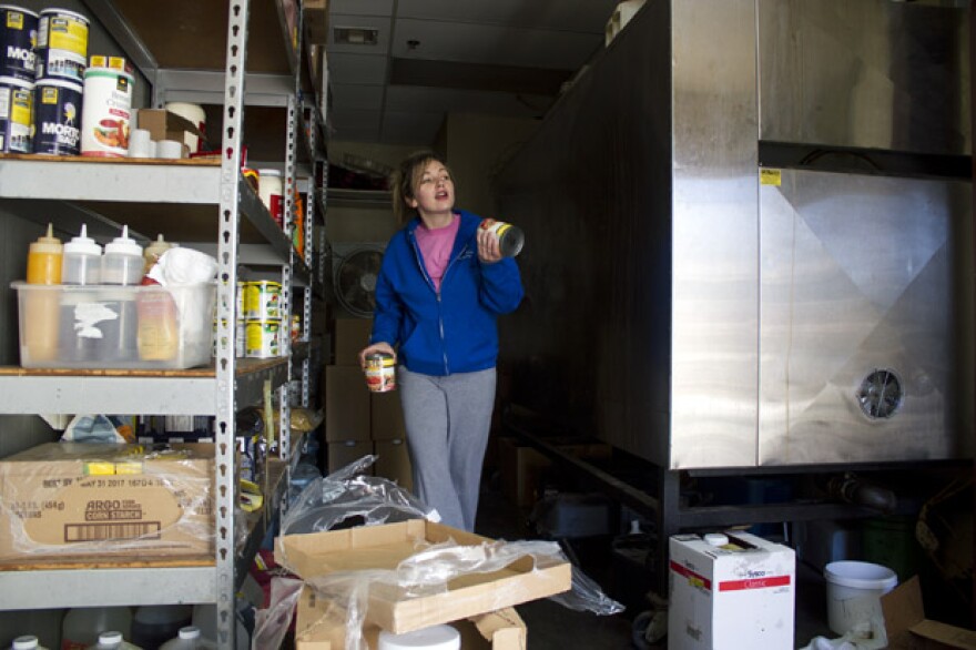 Workers at Pecan Creek Catering in New Cordell, Okla.,unload crates, cans and boxes of food and prepare for catering jobs in oil fields in western parts of the state.