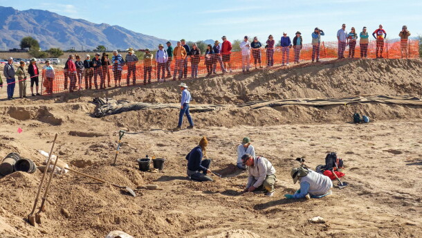 Pima County Historic Preservation Officer Ian Milliken speaks to a crowd at the Sunset Road archaeological site during a public viewing event in 2016.