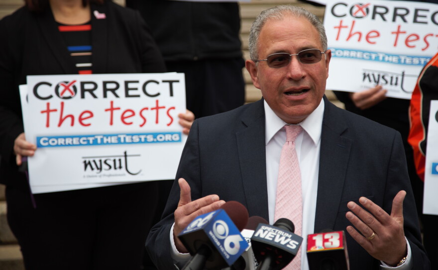 Andrew Pallotta, president of NYSUT, speaks at Monday's rally in Albany.