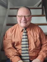David Gloss sitting on stairs