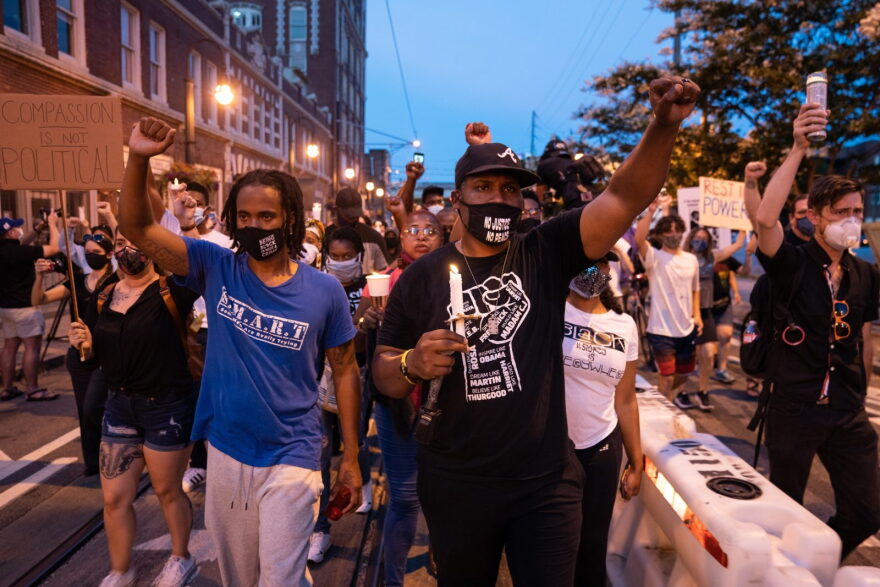 People take part in a candlelight vigil for U.S. Rep. John Lewis in Atlanta, Georgia.
