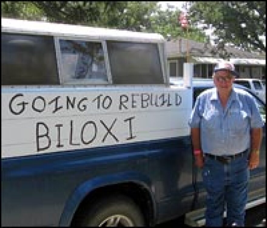 Donald Bliss, retired construction superintendent, stands next to the pickup truck he drove to Biloxi from his home in of Greene, Iowa. "We just wanted to help," he says of his church group.