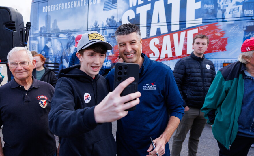 U.S. Rep. Tom Barrett, R-Charlotte, greets supporters in Lansing Township, Mich., on Oct. 24, 2026, during a stop on Republican U.S. Senate nominee Mike Rogers' "We Have a State to Save" bus tour.