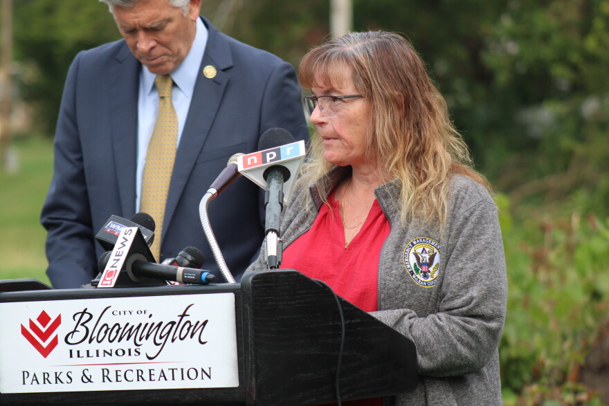 Cathy Beck stands behind a podium at an September 23 press conference.