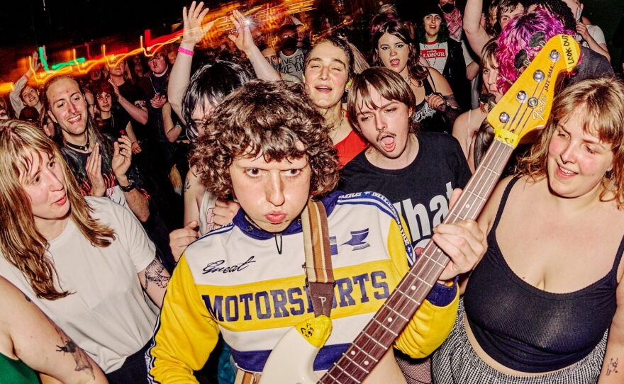 Issley Manzi plays a guitar at a previous Queercore fest