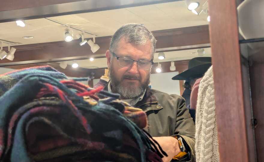 Customers searching through products at Scotland House in Williamsburg.