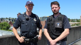 Officer John Hill and Ryan Miles, a designated mental health professional with the Tacoma Police Department.