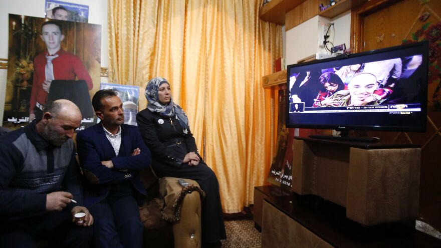 The father, center, and mother of Palestinian Abdul Fatah al-Sharif watch the sentencing hearing of Israeli soldier Elor Azaria, who killed their son in March of 2016.