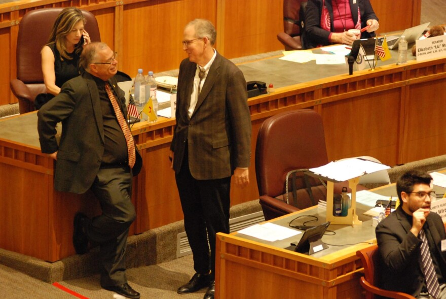 Sen. Daniel Ivey-Soto, left, chats with Senate Majority Leader Peter Wirth on the Senate floor during the 2024 legislative session.