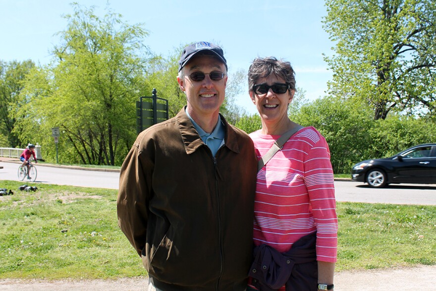 Bill and Vera Emmons walk back through Forest Park after spending the morning at the Earth Day festival. 