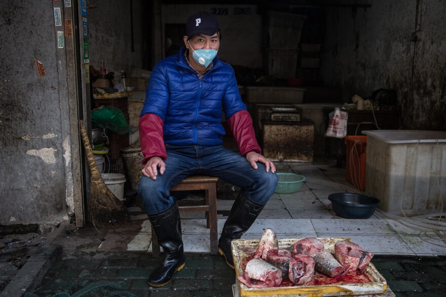 A street vendor operates in an alley.