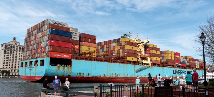 A large container ship sailing into the port of Savannah, GA