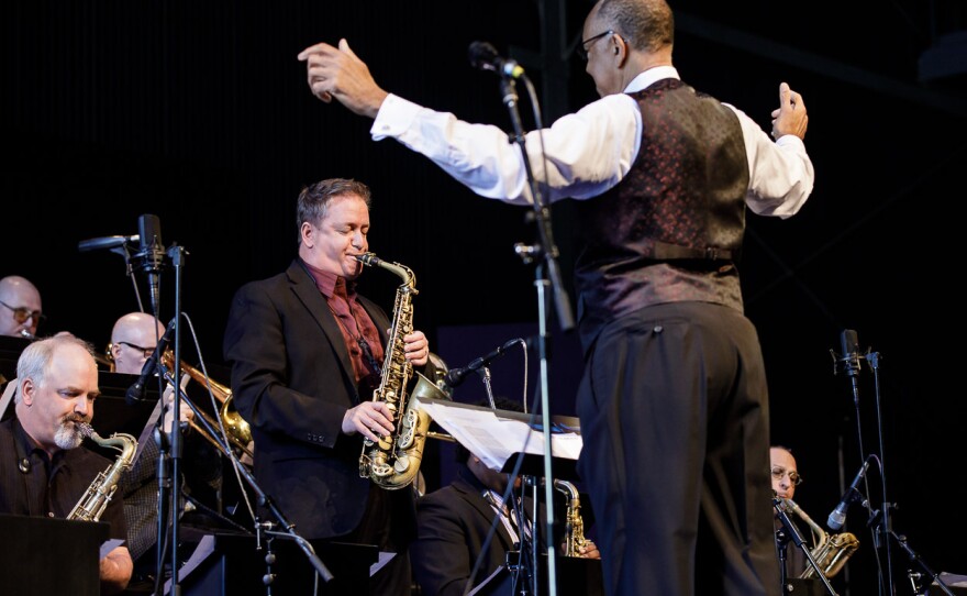 Mark Taylor solos on alto sax, John Clayton conducting