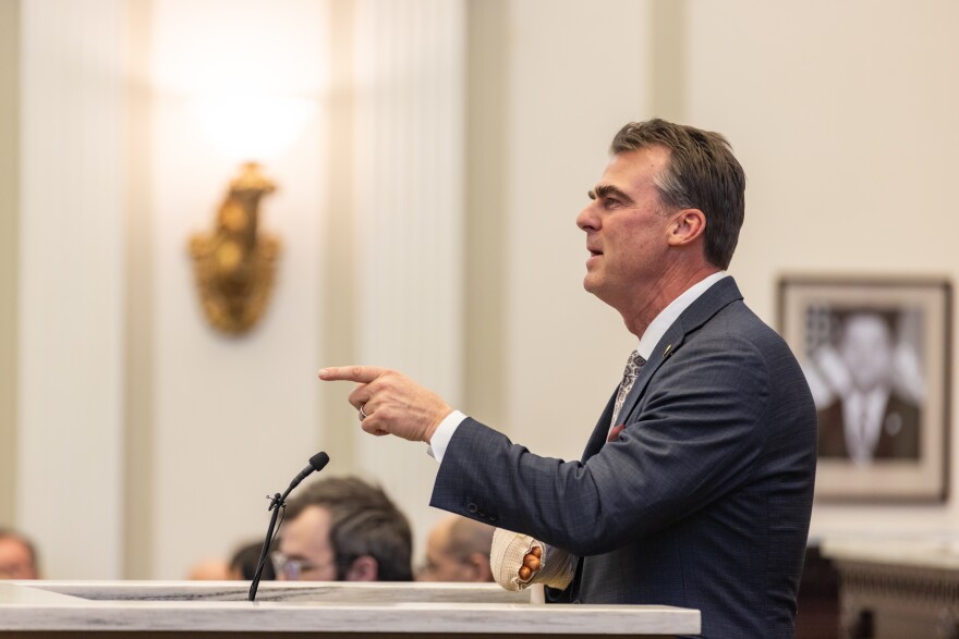 Oklahoma Gov. Kevin Stitt gestures as he delivers the 2026 State of the State address.