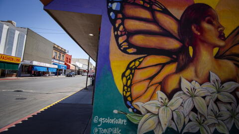 Downtown Nogales mural on a wall showing a woman with butterfly wings