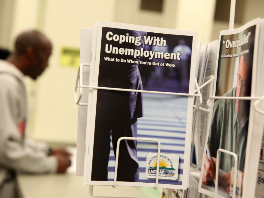 Pamphlets with information about unemployment are displayed in a career center in Oakland, Calif.
